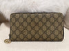 Gucci zipper wallet GG supreme canvas